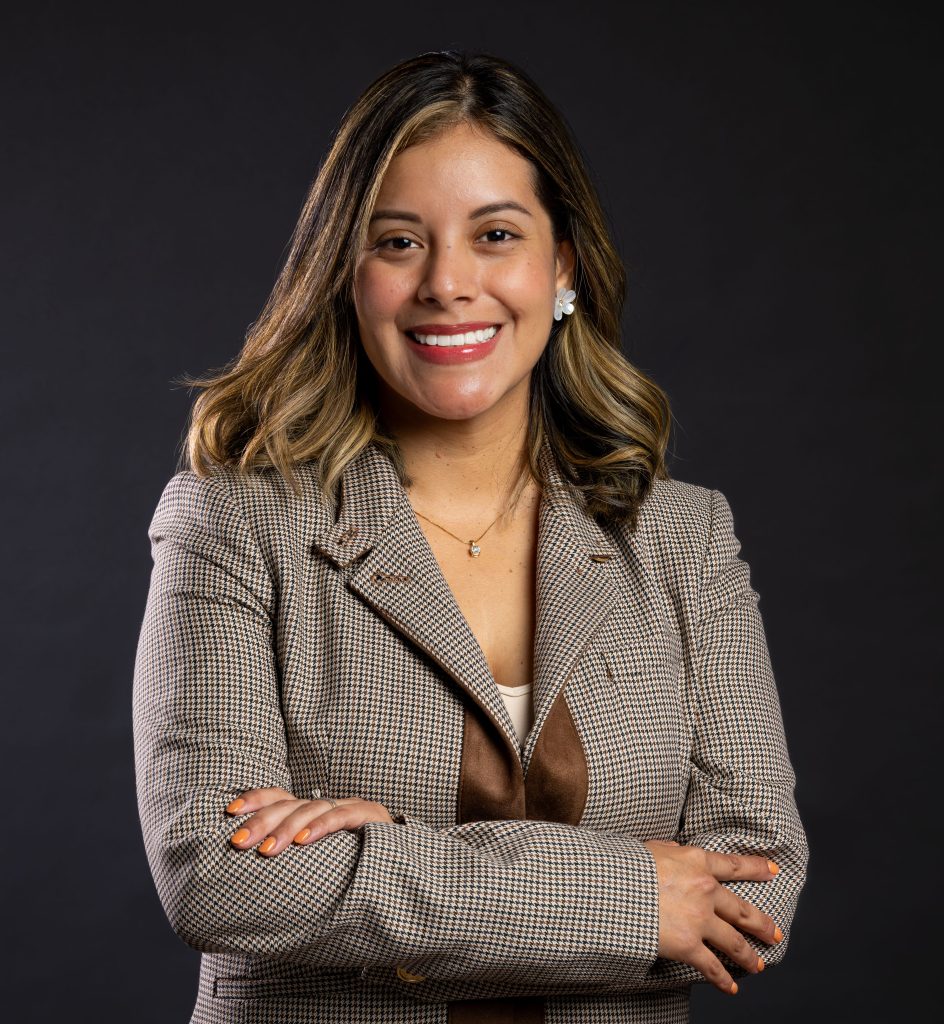 Dentist in Frederick smiling with arms crossed, highlighting trust and patient-focused care